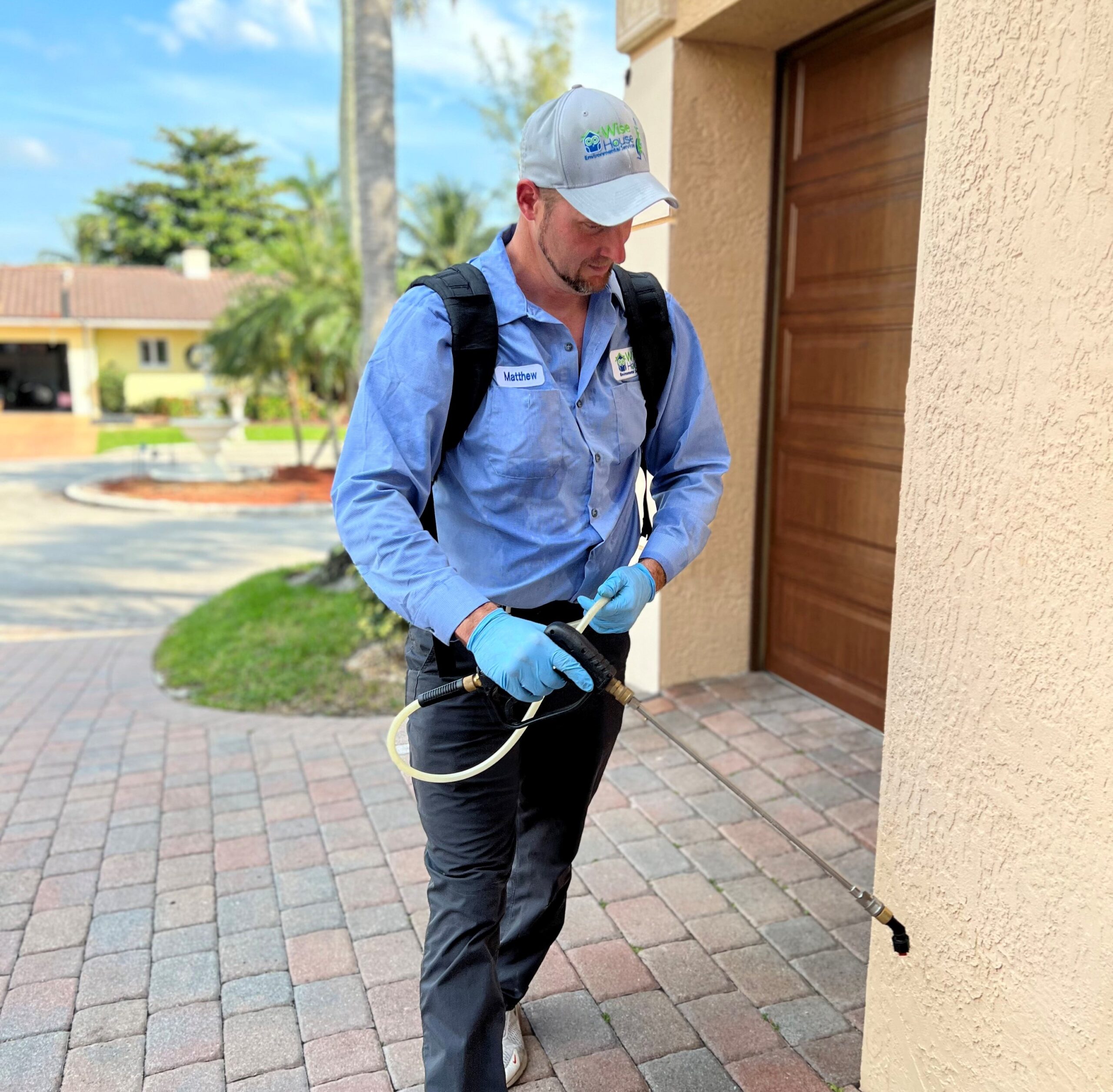 ant control services technician treating home